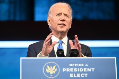 US President-elect Joe Biden delivers remarks on the Electoral college certification at the Queen Theatre in Wilmington, Delaware on December 14, 2020. (Photo by ROBERTO SCHMIDT / AFP)<!-- NICAID(14668804) -->