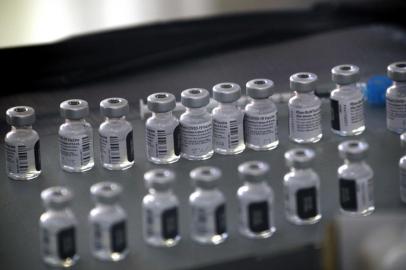 Vials of the Pfizer-BioNTech Covid-19 vaccine are prepared to be administered to front-line health care workers under an emergency use authorization at a drive up vaccination site from Renown Health in Reno, Nevada on December 17, 2020. (Photo by Patrick T. Fallon / AFP)<!-- NICAID(14674278) -->