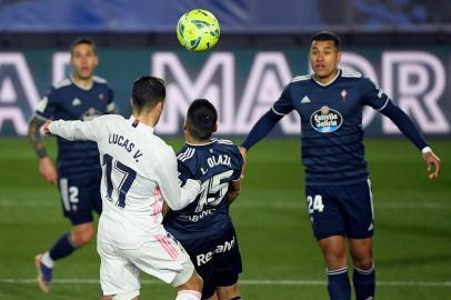 Real Madrids Spanish forward Lucas Vazquez (L) scores a header during the Spanish League football match between Real Madrid and Celta Vigo at the Alfredo Di Stefano stadium in Valdebebas, northeast of Madrid, on January 2, 2021. (Photo by OSCAR DEL POZO / AFP)<!-- NICAID(14681981) -->