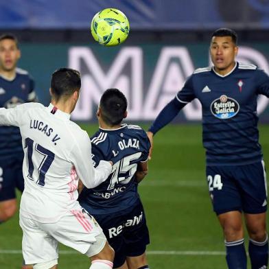 Real Madrids Spanish forward Lucas Vazquez (L) scores a header during the Spanish League football match between Real Madrid and Celta Vigo at the Alfredo Di Stefano stadium in Valdebebas, northeast of Madrid, on January 2, 2021. (Photo by OSCAR DEL POZO / AFP)<!-- NICAID(14681981) -->