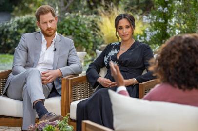 This undated image released March 7, 2021 courtesy of Harpo Productions shows Britains Prince Harry (L) and his wife Meghan (C), Duchess of Sussex, in a conversation with US television host Oprah Winfrey. - Britains royal family on March 7, 2021 braced for further revelations from Prince Harry and his American wife, Meghan, as a week of transatlantic claim and counter-claim reaches a climax with the broadcast of their interview with Oprah Winfrey. The two-hour interview with the US TV queen is the biggest royal tell-all since Harrys mother princess Diana detailed her crumbling marriage to his father Prince Charles in 1995. (Photo by Joe PUGLIESE / HARPO PRODUCTIONS / AFP) / RESTRICTED TO EDITORIAL USE - MANDATORY CREDIT AFP PHOTO/ HARPO PRODUCTIONS -  Joe PUGLIESE - NO MARKETING NO ADVERTISING CAMPAIGNS - DISTRIBUTED AS A SERVICE TO CLIENTS --- NO ARCHIVE ---<!-- NICAID(14729886) -->