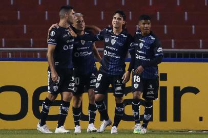 Ecuadors Independiente del Valle Argentine Lorenzo Faravelli (2nd R) celebrates after scoring against Chiles Union Espanola during their Copa Libertadores football tournament second round match at the Rodrigo Paz Delgado Stadium in Quito on March 16, 2021. (Photo by Cristina Vega RHOR / AFP)<!-- NICAID(14737041) -->