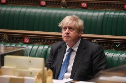 A handout photograph released by the UK Parliament shows Britains Prime Minister Boris Johnson attending Prime Ministers Questions (PMQs) in a socially distanced, hybrid session at the House of Commons, in central London on April 28, 2021. - Prime Minister Boris Johnson on Wednesday denied breaking the rules over the refurbishment of his Downing Street flat, as Britains Electoral Commission watchdog launched a formal probe. (Photo by JESSICA TAYLOR / various sources / AFP) / RESTRICTED TO EDITORIAL USE - NO USE FOR ENTERTAINMENT, SATIRICAL, ADVERTISING PURPOSES - MANDATORY CREDIT  AFP PHOTO / Jessica Taylor /UK Parliament<!-- NICAID(14768639) -->