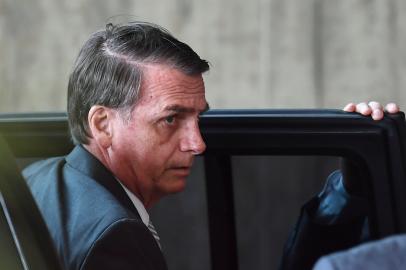 Brazilian President-elect Jair Bolsonaro arrives at the transitional governments headquarters in Brasilia, on November 27, 2018. - Bolsonaro takes office on January 1, 2019. (Photo by EVARISTO SA / AFP)