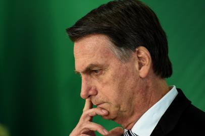 Brazilian president-elect Jair Bolsonaro gestures as he delivers a joint press conference with Brazilian President Michel Temer (out of frame) after a meeting in Brasilia on November 7, 2018. (Photo by EVARISTO SA / AFP)