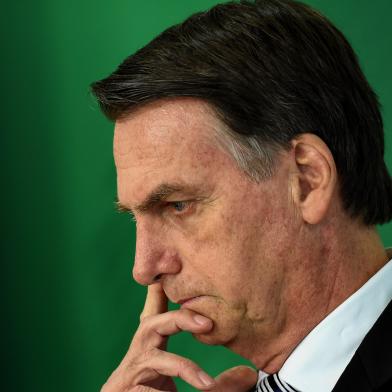 Brazilian president-elect Jair Bolsonaro gestures as he delivers a joint press conference with Brazilian President Michel Temer (out of frame) after a meeting in Brasilia on November 7, 2018. (Photo by EVARISTO SA / AFP)