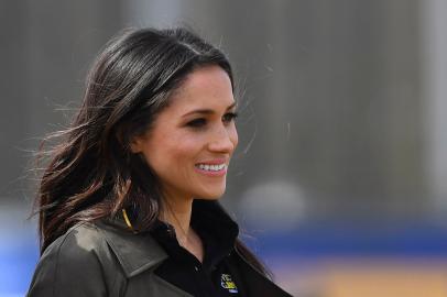 US actress Meghan Markle arrives to meet participants at the UK team trials for the Invictus Games Sydney 2018 at the University of Bath Sports Training Village in Bath, southwest England on April 6, 2018 with her fiancee Britains Prince Harry (unseen)The Invictus Games is an international sport event for wounded, injured and sick (WIS) servicemen and women, both serving and veteran. The Games aims to use the power of sport to inspire recovery, support rehabilitation and generate a wider understanding of all those who serve their country.  / AFP PHOTO / Ben STANSALL