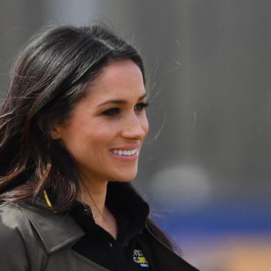 US actress Meghan Markle arrives to meet participants at the UK team trials for the Invictus Games Sydney 2018 at the University of Bath Sports Training Village in Bath, southwest England on April 6, 2018 with her fiancee Britains Prince Harry (unseen)The Invictus Games is an international sport event for wounded, injured and sick (WIS) servicemen and women, both serving and veteran. The Games aims to use the power of sport to inspire recovery, support rehabilitation and generate a wider understanding of all those who serve their country.  / AFP PHOTO / Ben STANSALL