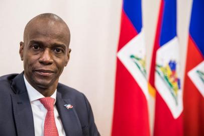 (FILES) In this file photo taken on October 22, 2019 President Jovenel Moise sits at the Presidential Palace during an interview with AFP in Port-au-Prince, October 22, 2019. - Haitian President Jovenel Moise was assassinated on July 7, 2021, at his home by a commando, interim Prime Minister Claude Joseph announced. Joseph said he was now in charge of the country. (Photo by Valerie Baeriswyl / AFP)<!-- NICAID(14827806) -->