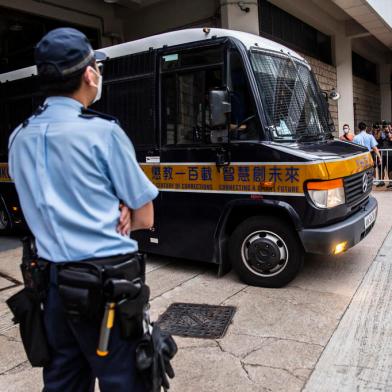 A correctional services department van leaves the High Court in Hong Kong on July 27, 2021, after Tong Ying-kit was convicted of terrorism and inciting secession in the first trial conducted under a national security law imposed by China. (Photo by ISAAC LAWRENCE / AFP)<!-- NICAID(14845515) -->