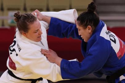 Russias Aleksandra Babintseva (white) and Brazils Mayra Aguiar compete in the judo womens -78kg repechage bout during the Tokyo 2020 Olympic Games at the Nippon Budokan in Tokyo on July 29, 2021. (Photo by Jack GUEZ / AFP)<!-- NICAID(14847720) -->