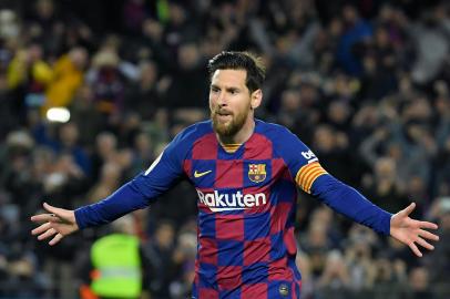 (FILES) In this file photo taken on March 07, 2020, Barcelonas Argentine forward Lionel Messi celebrates after scoring a goal during the Spanish league football match between FC Barcelona and Real Sociedad at the Camp Nou stadium in Barcelona, Spain. - Lionel Messi said on September 4, 2020 that he will stay at Barcelona, insisting he could never go to court against the club of his life. (Photo by LLUIS GENE / AFP)<!-- NICAID(14584804) -->