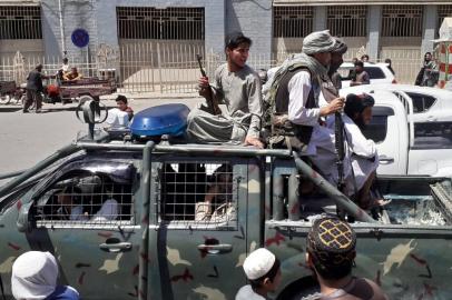 Taliban fighters are pictured in a vehicle of Afghan National Directorate of Security (NDS) on a street in Kandahar on August 13, 2021. (Photo by - / AFP)<!-- NICAID(14861881) -->