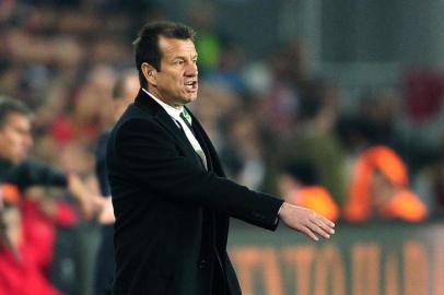 Brazil`s head coach Carlos Caetano Bledorn Verri Dunga gestures during the friendly football match Turkey  vs Brazil on November 12, 2014 at Fenerbahce Sukru Saracoglu stadium in Istanbul. AFP PHOTO/OZAN KOSE