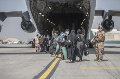 In this handout image courtesy of the US Marine Corps, Families begin to board a US Air Force Boeing C-17 Globemaster III during an evacuation at Hamid Karzai International Airport, Kabul, Afghanistan, August 23, 2021. (Photo by Samuel RUIZ / US MARINE CORPS / AFP) / RESTRICTED TO EDITORIAL USE - MANDATORY CREDIT AFP PHOTO / SAMUEL RUIZ / US MARINE CORPS  - NO MARKETING - NO ADVERTISING CAMPAIGNS - DISTRIBUTED AS A SERVICE TO CLIENTS<!-- NICAID(14870833) -->