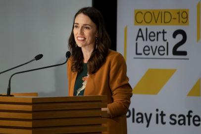 (FILES) In this file photo taken on June 08, 2020 New Zealands Prime Minister Jacinda Ardern takes part in a press conference about the Covid-19 coronavirus at Parliament in Wellington. - New Zealand on August 27, 2021 extended a national lockdown sparked by a Delta virus outbreak into next week but warned restrictions would last longer in the infection epicentre of Auckland. (Photo by Marty MELVILLE / AFP)<!-- NICAID(14873554) -->