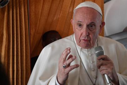 Pope Francis speaks with journalists on board an Alitalia aircraft enroute from Bratislavas Milan Rastislav Stefanik International airport in Bratislava, Slovakia, back to Rome on September 15, 2021. (Photo by Tiziana FABI / POOL / AFP)<!-- NICAID(14890849) -->