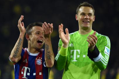 504671369Bayern Munichs Brazilian defender Rafinha and Bayern Munichs goalkeeper Manuel Neuer (R) celebrate after the German first division Bundesliga football match Borussia Dortmund vs FC Bayern Munich in Dortmund, western Germany, on April 4, 2015. Bayern Munich won the match 0-1. AFP PHOTO /  PATRIK STOLLARZRESTRICTIONS - DFL RULES TO LIMIT THE ONLINE USAGE DURING MATCH TIME TO 15 PICTURES PER MATCH. IMAGE SEQUENCES TO SIMULATE VIDEO IS NOT ALLOWED AT ANY TIME. FOR FURTHER QUERIES PLEASE CONTACT DFL DIRECTLY AT + 49 69 650050. (Photo by PATRIK STOLLARZ / AFP)Editoria: SPOLocal: DortmundIndexador: PATRIK STOLLARZSecao: soccerFonte: AFPFotógrafo: STR<!-- NICAID(14922625) -->