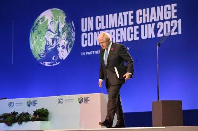 Britains Prime Minister Boris Johnson walks off of the stage after speaking at the COP26 UN Climate Change Conference in Glasgow, Scotland on November 1, 2021. - COP26, running from October 31 to November 12 in Glasgow will be the biggest climate conference since the 2015 Paris summit and is seen as crucial in setting worldwide emission targets to slow global warming, as well as firming up other key commitments. (Photo by Jeff J Mitchell / POOL / AFP)<!-- NICAID(14930027) -->