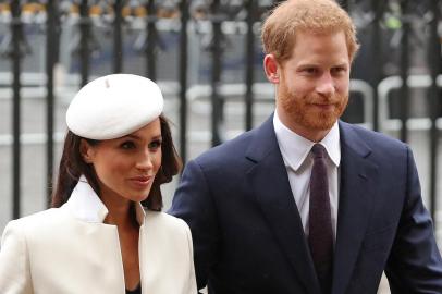 (FILES) In this file photo Britains Prince Harry (R) and Meghan Markle attend a Commonwealth Day Service at Westminster Abbey in central London, on March 12, 2018. - Britains Prince Harry, who has blamed press intrusion for contributing to his mother Princess Dianas death in 1997, has told US chat show host Oprah Winfrey he was worried about history repeating itself. Harry and his wife Meghan Markle rocked Britains monarchy with their shock announcement in January 2020 that they were stepping back from royal duties. CBS on February 28, 2021 released brief clips of an intimate interview with Winfrey about their lives which will air March 7. (Photo by Daniel LEAL-OLIVAS / AFP)<!-- NICAID(14736946) -->