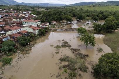 Aerial view showing a flooded area of Itambe caused by heavy rainfall in the Brazilian state of Bahia State, taken on December 29, 2021. - Bahia State faces a heavy cost from the flooding caused by torrential rains that burst two dams and left at least 21 people dead. (Photo by RICARDO DUTRA / AFP)<!-- NICAID(14981885) -->