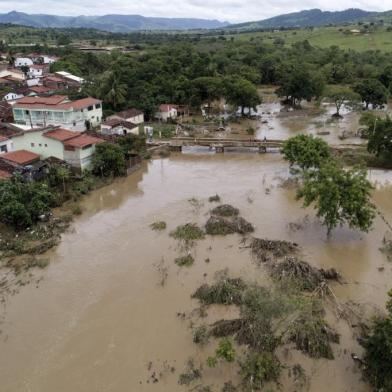 Aerial view showing a flooded area of Itambe caused by heavy rainfall in the Brazilian state of Bahia State, taken on December 29, 2021. - Bahia State faces a heavy cost from the flooding caused by torrential rains that burst two dams and left at least 21 people dead. (Photo by RICARDO DUTRA / AFP)<!-- NICAID(14981885) -->