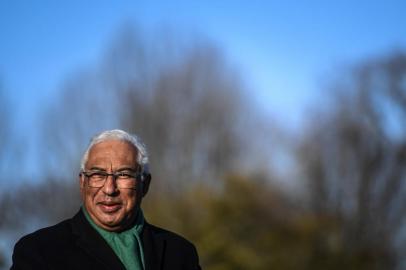 Portuguese Prime Minister and Socialist Party candidate Antonio Costa addresses journalists after casting his ballot at a polling station in Porto on January 23, 2022, on an early polling day ahead of the January 30 election day. - Over 300,000 Portuguese voters who have signed up to vote a week early, began to cast their ballots in Portugal today at 8:00 am (0800 GMT) for a snap general election, with polls showing the incumbent Socialists still ahead though with their lead over the nearest centre-right rivals narrowing. The early voting option was provided this year to reduce crowding on election day, on January 30, due to the pandemic. (Photo by PATRICIA DE MELO MOREIRA / AFP)<!-- NICAID(14999249) -->