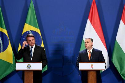 Hungarys Prime Minister Viktor Orban (R) and Brazils President Jair Bolsonaro give a joint press conference on February 17, 2022 in Budapest, Hungary. (Photo by Attila KISBENEDEK / AFP)<!-- NICAID(15018853) -->