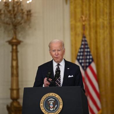 US President Joe Biden speaks in the East Room of the White House about Russian military activity near Ukraine on February 22, 2022, in Washington, DC. - The United States said Tuesday that Russias move into eastern Ukraine amounts to the beginning of an invasion and warned that severe sanctions would be announced shortly. (Photo by Brendan SMIALOWSKI / AFP)<!-- NICAID(15023710) -->