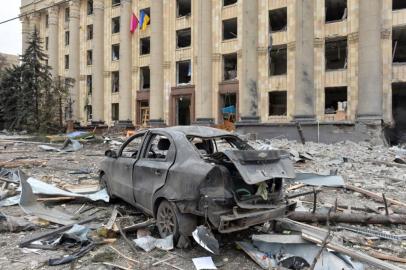 This general view shows the damaged local city hall of Kharkiv on March 1, 2022, destroyed as a result of Russian troop shelling. - The central square of Ukraines second city, Kharkiv, was shelled by advancing Russian forces who hit the building of the local administration, regional governor Oleg Sinegubov said. Kharkiv, a largely Russian-speaking city near the Russian border, has a population of around 1.4 million. (Photo by Sergey BOBOK / AFP)<!-- NICAID(15029667) -->