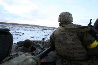 Servicemen of the Ukrainian Military Forces  sit in their armoured vehicle following fighting against Russian troops and Russia-backed separatists near Zolote village, Lugansk region on March 6, 2022. - Russias invasion of Ukraine, now in its eleventh day, has seen more than 1.5 million people flee the country in what the UN has called Europes fastest growing refugee crisis since World War II. (Photo by Anatolii Stepanov / AFP)<!-- NICAID(15034777) -->