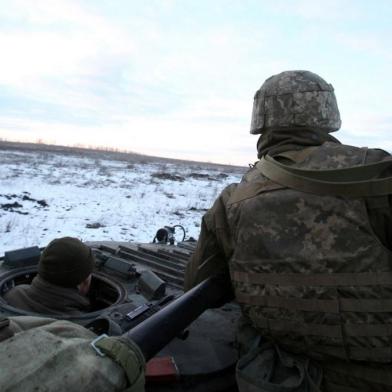 Servicemen of the Ukrainian Military Forces  sit in their armoured vehicle following fighting against Russian troops and Russia-backed separatists near Zolote village, Lugansk region on March 6, 2022. - Russias invasion of Ukraine, now in its eleventh day, has seen more than 1.5 million people flee the country in what the UN has called Europes fastest growing refugee crisis since World War II. (Photo by Anatolii Stepanov / AFP)<!-- NICAID(15034777) -->