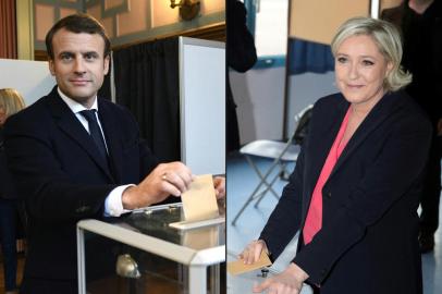 (COMBO) This combination of pictures created on May 07, 2017 showsFrench presidential election candidate for the En Marche ! movement Emmanuel Macron (L) casting his ballot at a polling station in Le Touquet, northern France, and French presidential election candidate for the far-right Front National (FN - National Front) party Marine Le Pen casting her ballot at a polling station in Henin-Beaumont, north-western France, on May 7, 2017, during the second round of the French presidential election. (Photo by Eric FEFERBERG and joel SAGET / AFP)Editoria: POLLocal: ParisIndexador: ERIC FEFERBERGSecao: electionFonte: AFPFotógrafo: STF<!-- NICAID(15060931) -->