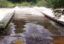 Mais uma ponte é submersa pela cheia de rios na Serra