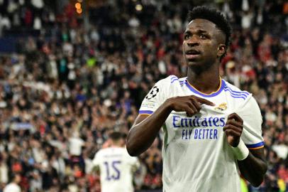 Real Madrids Brazilian forward Vinicius Junior celebrates scoring the opening goal during the UEFA Champions League final football match between Liverpool and Real Madrid at the Stade de France in Saint-Denis, north of Paris, on May 28, 2022. (Photo by JAVIER SORIANO / AFP)<!-- NICAID(15109748) -->