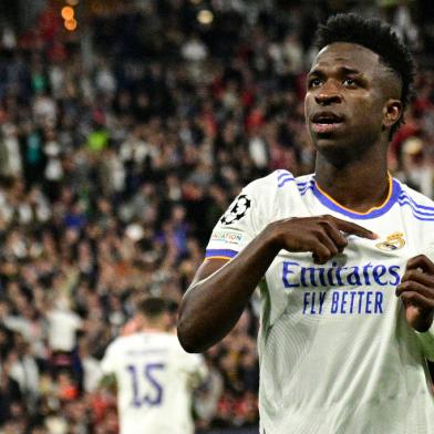 Real Madrids Brazilian forward Vinicius Junior celebrates scoring the opening goal during the UEFA Champions League final football match between Liverpool and Real Madrid at the Stade de France in Saint-Denis, north of Paris, on May 28, 2022. (Photo by JAVIER SORIANO / AFP)<!-- NICAID(15109748) -->