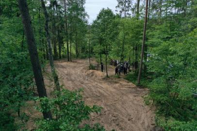 A aerial view of the Bialucki Forest near Ilowo on July 13, 2022 the site where the mass grave of about 8,000 Geman Nazi victims from the nearby Soldau concentration camp in Dzialdowo was unearthed at the beginning of July 2022. (Photo by JANEK SKARZYNSKI / AFP)<!-- NICAID(15148300) -->