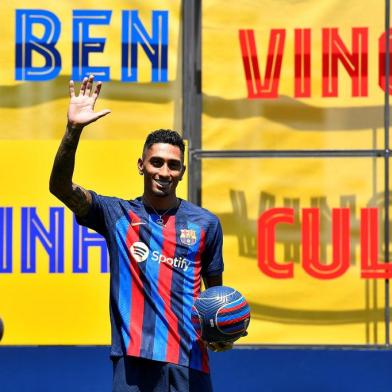 FC Barcelonas new Brazilian forward Raphael Dias Belloli, aka Raphinha, poses for pictures during his presentation ceremony at the Joan Gamper training ground in Sant Joan Despi, near Barcelona, on July 15, 2022. (Photo by Pau BARRENA / AFP)<!-- NICAID(15149752) -->