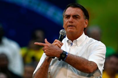 Brazils President Jair Bolsonaro addresses supporters during the Liberal Party (PL) national convention where he was officially appointed as candidate for re-election, at the Maracanazinho gymnasium in Rio de Janeiro, Brazil, on July 24, 2022. (Photo by MAURO PIMENTEL / AFP)<!-- NICAID(15162632) -->