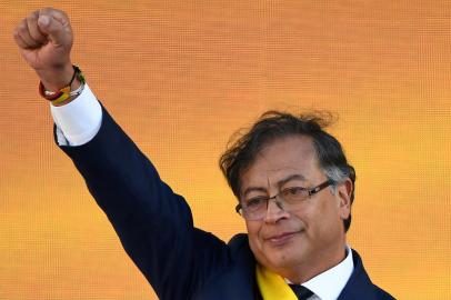 Colombias new President Gustavo Petro gestures after delivering a speech during his inauguration ceremony at Bolivar Square in Bogota, on August 7, 2022. - Gustavo Petro on Sunday took the oath of office as Colombias first-ever leftist president, before a crowd of hundreds of thousands at his inauguration in Bogota. (Photo by Juan BARRETO / AFP)<!-- NICAID(15169195) -->