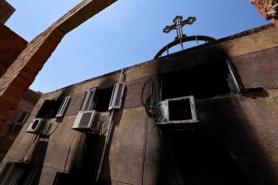 A picture shows the damage at the Abu Sifin church located in the densely populated Imbaba neighbourhood west of the Nile river, part of Giza governorate, on August 14, 2022, after more than 40 people were killed when a fire ripped through a Coptic Christian church during Sunday mass. - Witnesses described how people rushed into the burning house of worship to rescue those trapped but were soon overwhelmed by the heat and the deadly smoke. (Photo by Khaled DESOUKI / AFP)Editoria: DISLocal: GizaIndexador: KHALED DESOUKISecao: fireFonte: AFPFotógrafo: STF<!-- NICAID(15174831) -->