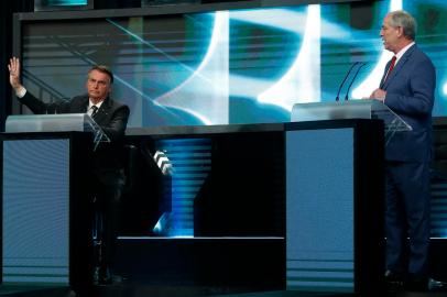 Brazilian presidential candidates Jair Bolsonaro (L) and Ciro Gomes (R) take part in the presidential debate ahead of the October 2 general election, at the SBT television network in Sao Paulo, Brazil, on September 24, 2022. - Luiz Inacio Lula da Silva, Presidential candidate for the leftist Workers Party (PT) and former President (2003-2010), didnt attend the debate. (Photo by Miguel SCHINCARIOL / AFP)Editoria: POLLocal: Sao PauloIndexador: MIGUEL SCHINCARIOLSecao: electionFonte: AFPFotógrafo: STR<!-- NICAID(15216321) -->