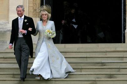 (FILES) In this file photo taken on April 9, 2005 Prince Charles and the Duchess of Cornwall, formerly Camilla Parker Bowles, walk from St Georges Chapel at Windsor Castle. - Trained from childhood to be king, Charles III has endured the longest wait for the throne in British history. He has spent virtually his entire life waiting to succeed his mother, Queen Elizabeth II, even as he took on more of her duties and responsibilities as she aged. But the late monarchs eldest son, 73, made the most of his record-breaking time as the longest-serving heir to the throne by forging his own path. (Photo by ALASTAIR GRANT / POOL / AFP)<!-- NICAID(15201887) -->