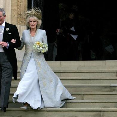 (FILES) In this file photo taken on April 9, 2005 Prince Charles and the Duchess of Cornwall, formerly Camilla Parker Bowles, walk from St Georges Chapel at Windsor Castle. - Trained from childhood to be king, Charles III has endured the longest wait for the throne in British history. He has spent virtually his entire life waiting to succeed his mother, Queen Elizabeth II, even as he took on more of her duties and responsibilities as she aged. But the late monarchs eldest son, 73, made the most of his record-breaking time as the longest-serving heir to the throne by forging his own path. (Photo by ALASTAIR GRANT / POOL / AFP)<!-- NICAID(15201887) -->