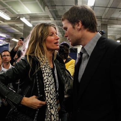 INDIANAPOLIS, IN - FEBRUARY 05: Tom Brady #12 of the New England Patriots chats with his wife Gisele Bundchen after losing to the New York Giants by a score of 21-17 in Super Bowl XLVI at Lucas Oil Stadium on February 5, 2012 in Indianapolis, Indiana.   Rob Carr/Getty Images/AFP<!-- NICAID(7926649) -->