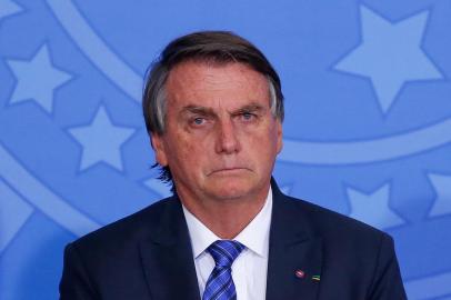 Brazils President Jair Bolsonaro attends a ceremony to announce new measures for the Entrepreneurial Brazil credit program at the Planalto Palace in Brasilia, on May 25, 2022. (Photo by Sergio Lima / AFP)Editoria: POLLocal: BrasíliaIndexador: SERGIO LIMASecao: governmentFonte: AFPFotógrafo: STR<!-- NICAID(15242125) -->