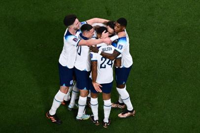 Englands forward #07 Jack Grealish (2R) celebrates with teammates after scoring his teams sixth goal during the Qatar 2022 World Cup Group B football match between England and Iran at the Khalifa International Stadium in Doha on November 21, 2022. (Photo by Jewel SAMAD / AFP)<!-- NICAID(15271635) -->