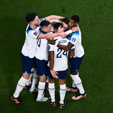 Englands forward #07 Jack Grealish (2R) celebrates with teammates after scoring his teams sixth goal during the Qatar 2022 World Cup Group B football match between England and Iran at the Khalifa International Stadium in Doha on November 21, 2022. (Photo by Jewel SAMAD / AFP)<!-- NICAID(15271635) -->