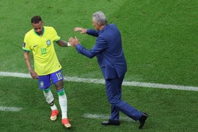 Brazils coach Tite greets Brazils forward #10 Neymar as he is replaced during the Qatar 2022 World Cup Group G football match between Brazil and Serbia at the Lusail Stadium in Lusail, north of Doha on November 24, 2022. (Photo by Giuseppe CACACE / AFP)<!-- NICAID(15276164) -->