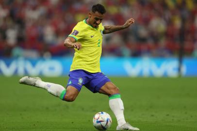 Brazils defender #02 Danilo kicks the ball during the Qatar 2022 World Cup Group G football match between Brazil and Serbia at the Lusail Stadium in Lusail, north of Doha on November 24, 2022. (Photo by Adrian DENNIS / AFP)<!-- NICAID(15281329) -->